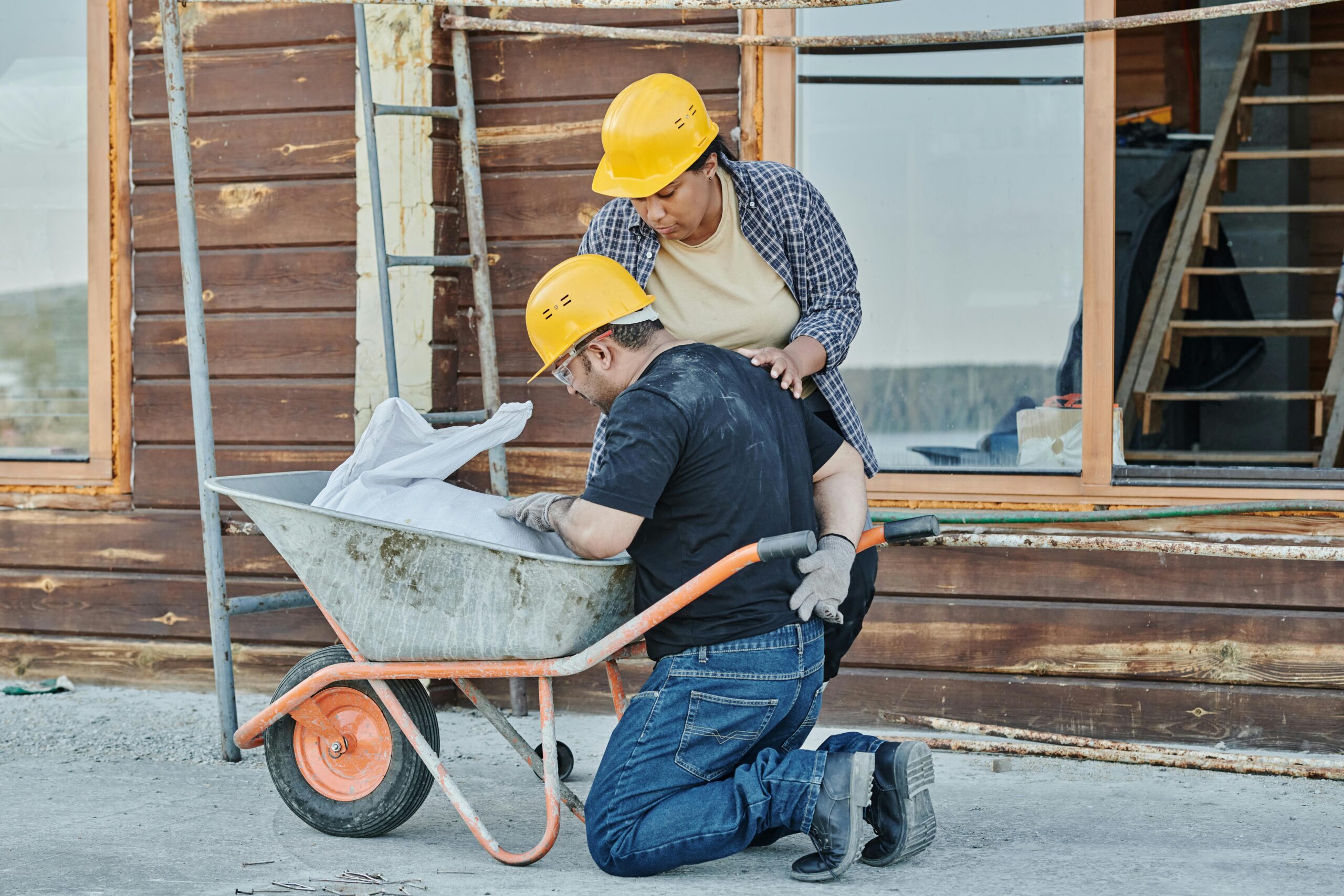 Injured Worker near wheel barrow. construction accident, work injury job injury lawyer attorney