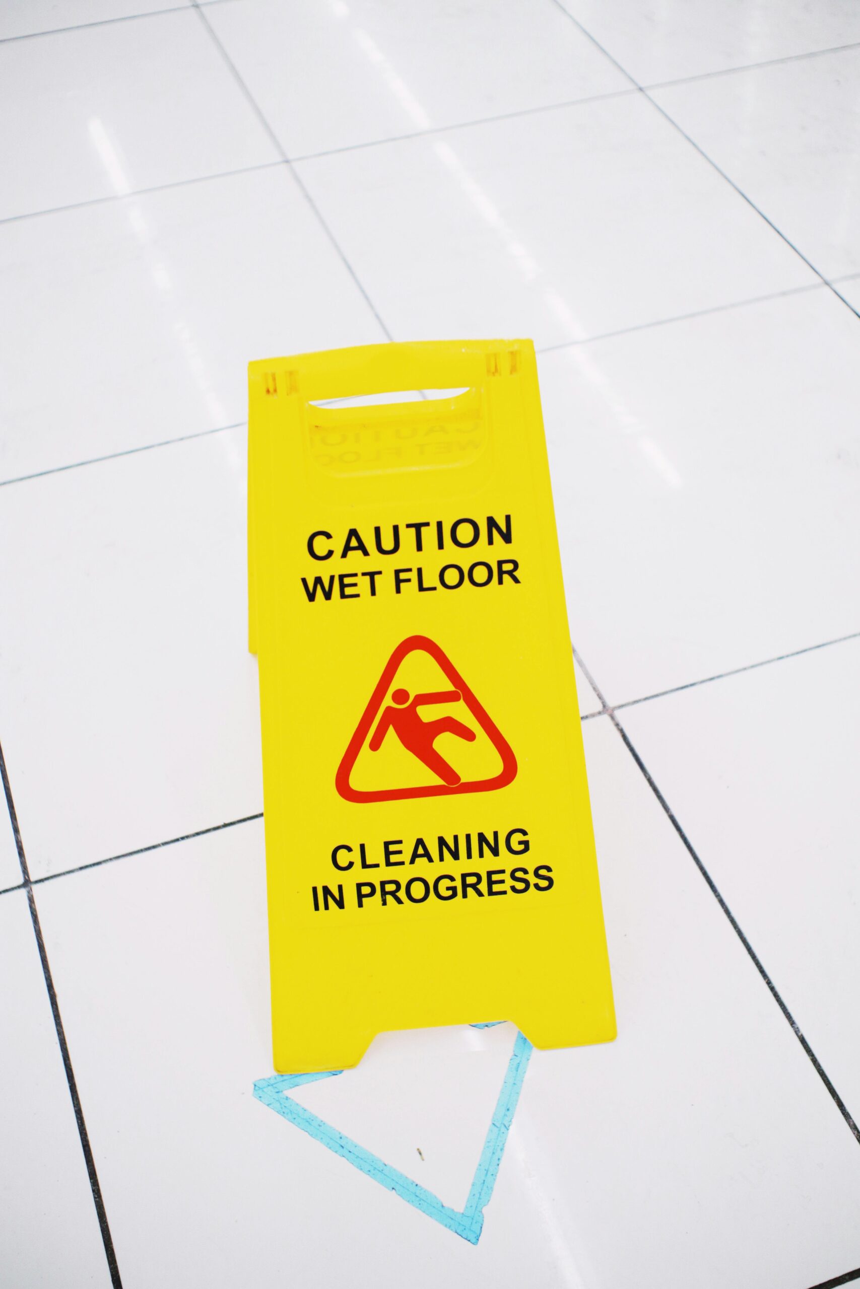 Caution wet floor sign on a tile floor